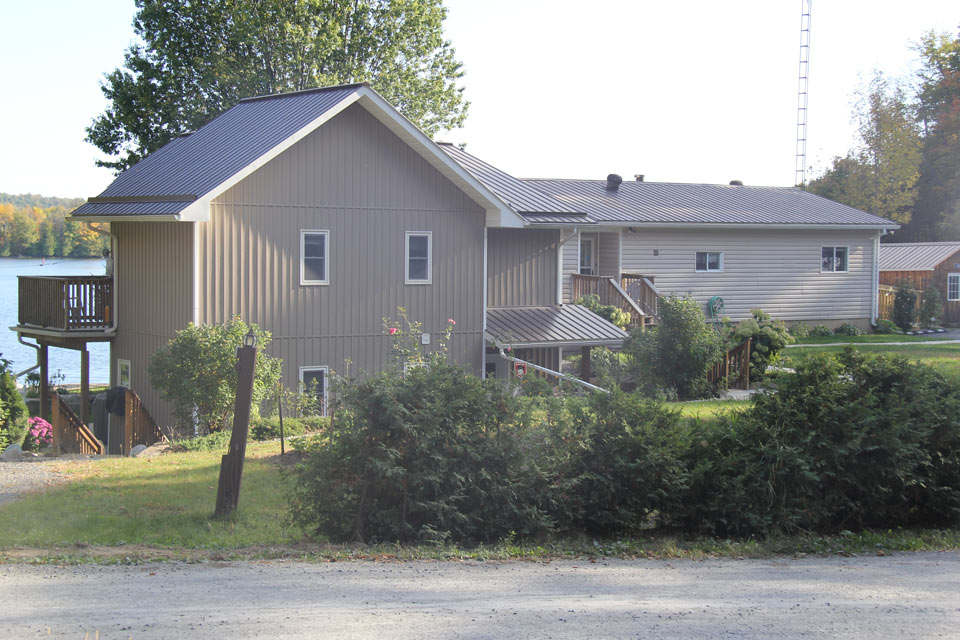 Residential - grey house with vertical siding - front view