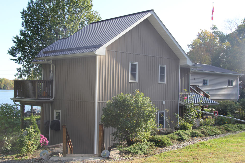 Residential - grey house with vertical siding - left front view