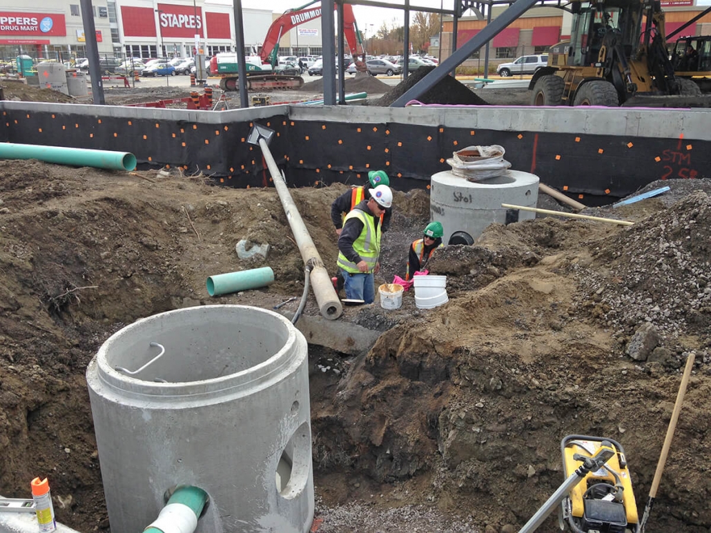 Commercial project - 2140 Carling Rd. - storm water service pump tank, foundation water proofing, trenching, excavation, site service, building service connection