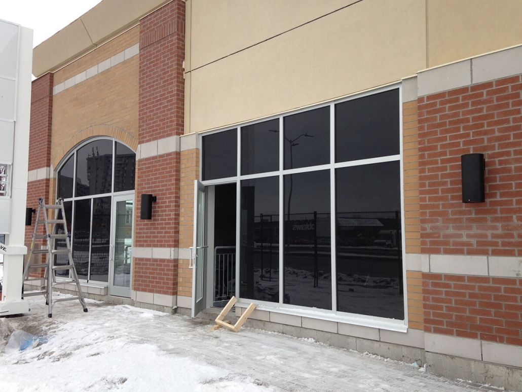 Commercial project - 2140 Carling Rd. - stucco masonry veneer - aluminum storefront glazing, exterior lighting, concrete banding, exterior with windows